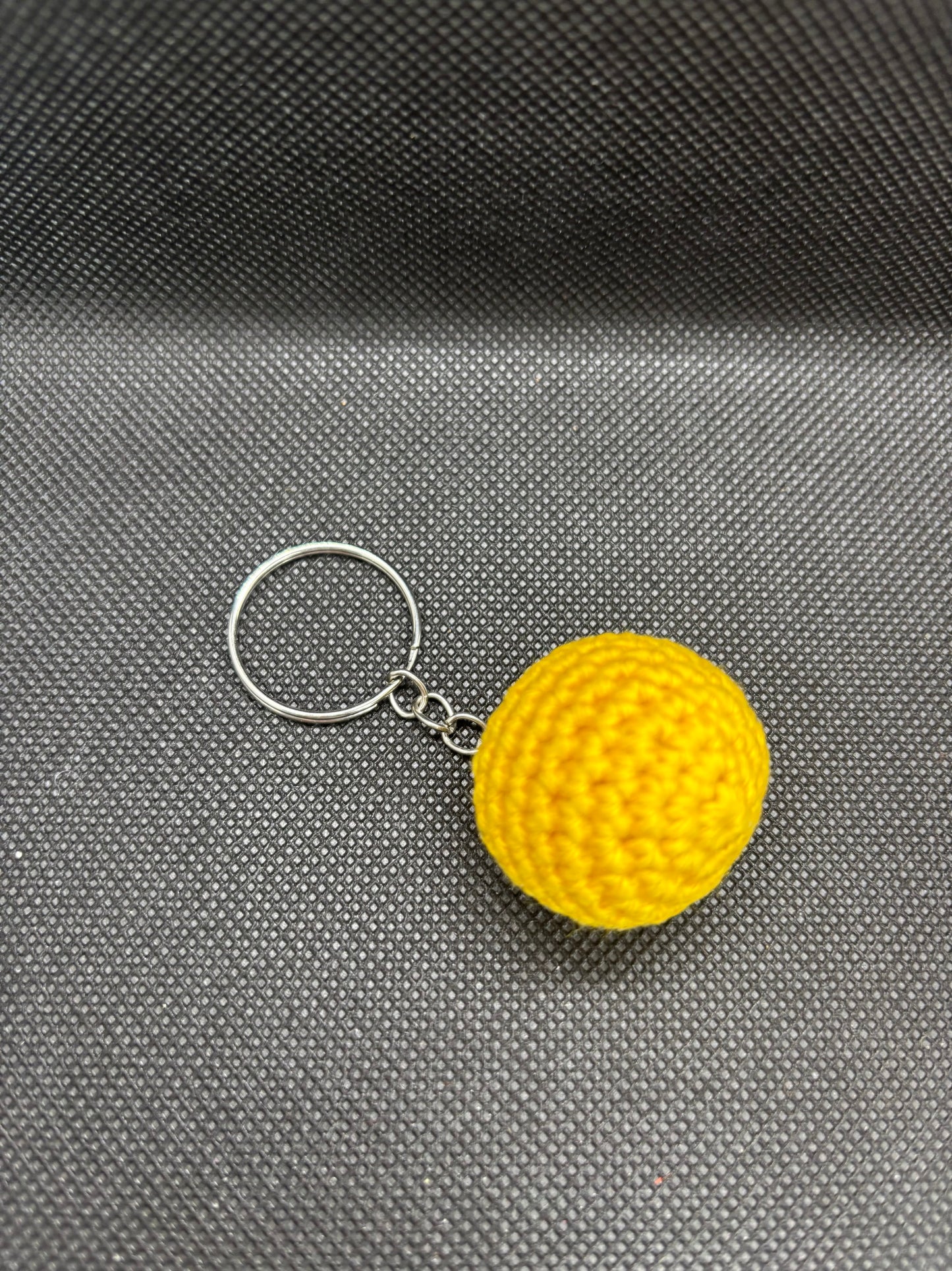 Porte clé balle jaune